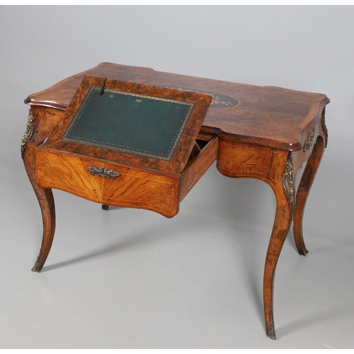 454 - A LOUIS XV STYLE BURR WALNUT AND MARQUETRY BUREAU PLAT. late 19th century, the shaped top with oval ... 