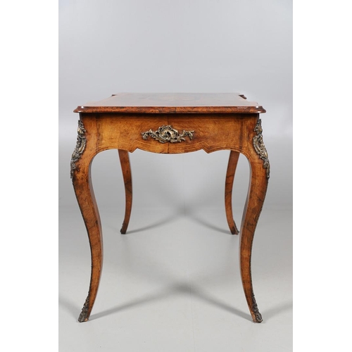 454 - A LOUIS XV STYLE BURR WALNUT AND MARQUETRY BUREAU PLAT. late 19th century, the shaped top with oval ... 