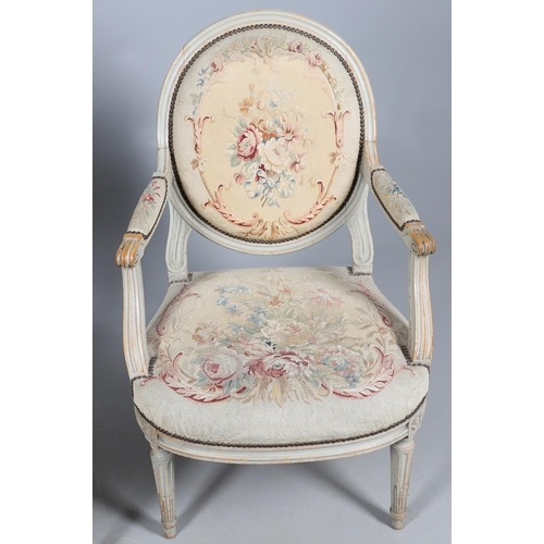 456 - A PAIR OF FRENCH PAINTED BEECH OPEN ARMCHAIRS. early 20th century, with brass studded floral tapestr... 