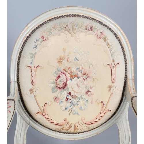 456 - A PAIR OF FRENCH PAINTED BEECH OPEN ARMCHAIRS. early 20th century, with brass studded floral tapestr... 