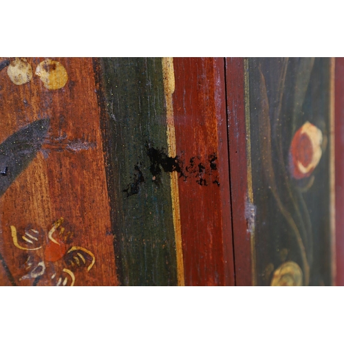 462A - A MID-19TH CENTURY TYROLEAN PROVINCIAL PAINTED PINE ARMOIRE. of canted form with drawer to the base,... 