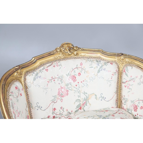 462 - A FRENCH ROCOCO STYLE GILT GESSO TUB CHAIR. of wide proportions, late 19th/early 20th century, the s... 