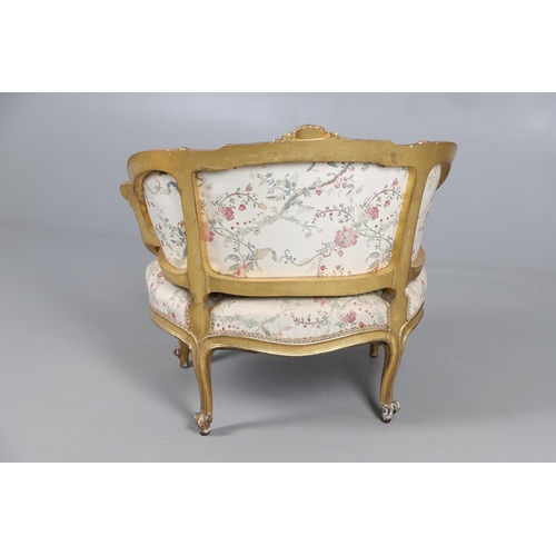 462 - A FRENCH ROCOCO STYLE GILT GESSO TUB CHAIR. of wide proportions, late 19th/early 20th century, the s... 