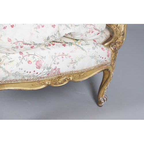 462 - A FRENCH ROCOCO STYLE GILT GESSO TUB CHAIR. of wide proportions, late 19th/early 20th century, the s... 