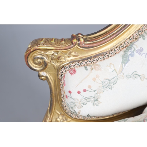 462 - A FRENCH ROCOCO STYLE GILT GESSO TUB CHAIR. of wide proportions, late 19th/early 20th century, the s... 