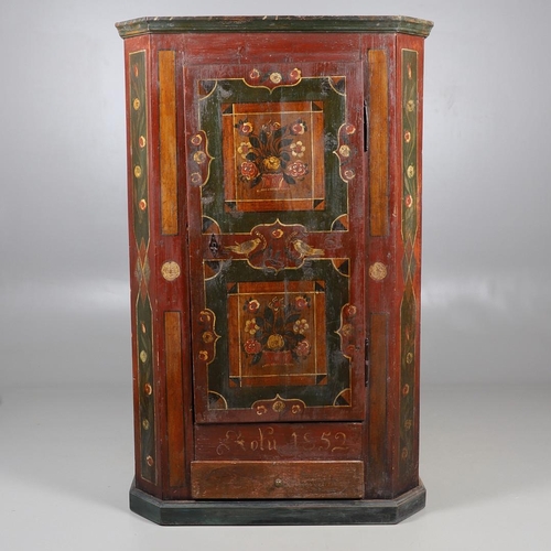 462A - A MID-19TH CENTURY TYROLEAN PROVINCIAL PAINTED PINE ARMOIRE. of canted form with drawer to the base,... 