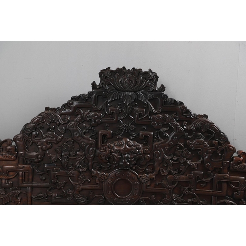 463 - AN EARLY 20TH CENTURY CHINESE CARVED HARDWOOD HEADBOARD. predominantly rosewood and other hardwood, ... 