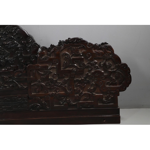 463 - AN EARLY 20TH CENTURY CHINESE CARVED HARDWOOD HEADBOARD. predominantly rosewood and other hardwood, ... 