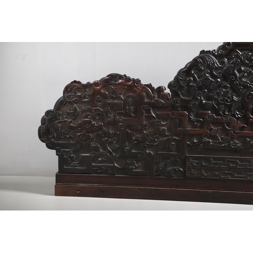 463 - AN EARLY 20TH CENTURY CHINESE CARVED HARDWOOD HEADBOARD. predominantly rosewood and other hardwood, ... 