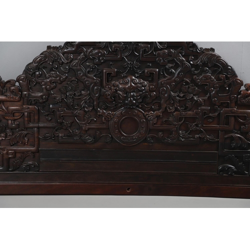 463 - AN EARLY 20TH CENTURY CHINESE CARVED HARDWOOD HEADBOARD. predominantly rosewood and other hardwood, ... 