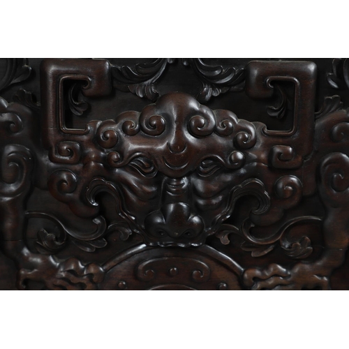 463 - AN EARLY 20TH CENTURY CHINESE CARVED HARDWOOD HEADBOARD. predominantly rosewood and other hardwood, ... 