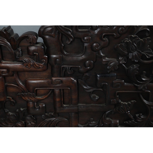 463 - AN EARLY 20TH CENTURY CHINESE CARVED HARDWOOD HEADBOARD. predominantly rosewood and other hardwood, ... 