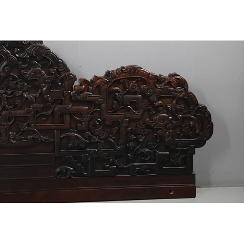 463 - AN EARLY 20TH CENTURY CHINESE CARVED HARDWOOD HEADBOARD. predominantly rosewood and other hardwood, ... 