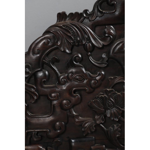 463 - AN EARLY 20TH CENTURY CHINESE CARVED HARDWOOD HEADBOARD. predominantly rosewood and other hardwood, ... 