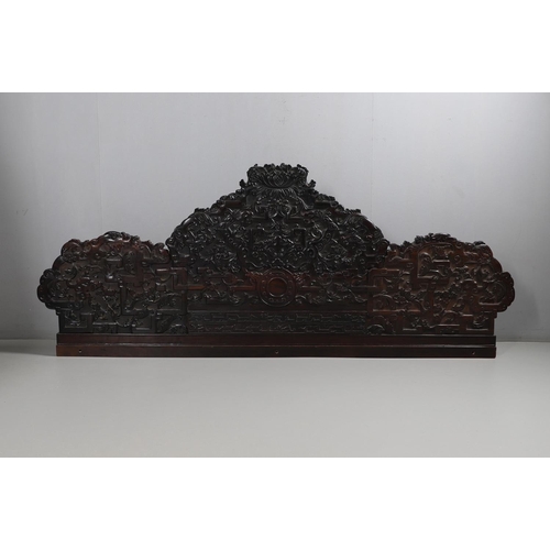 463 - AN EARLY 20TH CENTURY CHINESE CARVED HARDWOOD HEADBOARD. predominantly rosewood and other hardwood, ... 