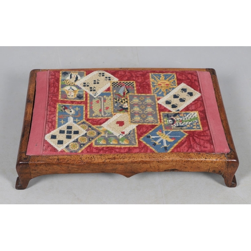 468 - A VICTORIAN OAK AND WOOLWORK FOOTSTOOL. the drop-in woolwork seat with unusual pack of cards design ... 