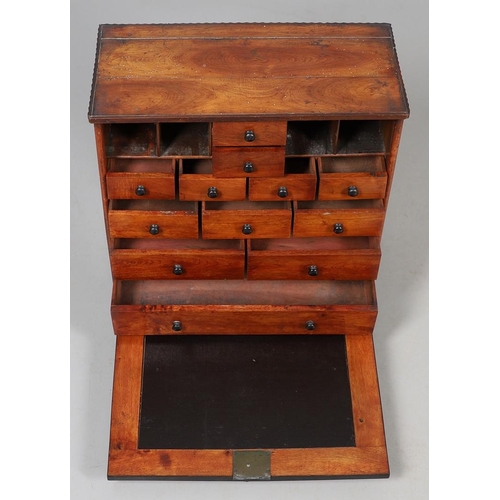 469 - AN EARLY 19TH CENTURY FRUITWOOD TABLE CABINET. the lockable fall front enclosing a fitted interior w... 