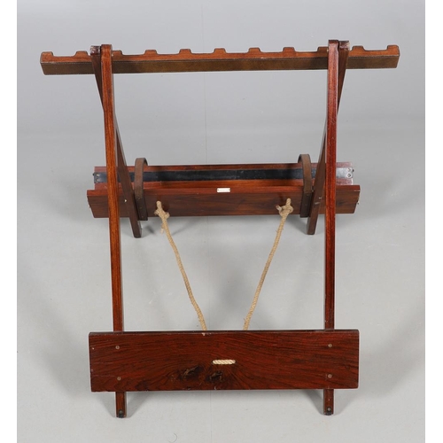 472 - A PORTABLE TEAK GUN RACK BY JOHN ORMISTON. labelled 