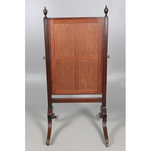 476 - A REGENCY MAHOGANY CHEVAL DRESSING MIRROR. the shorter than average frame with urn finials, on reede... 