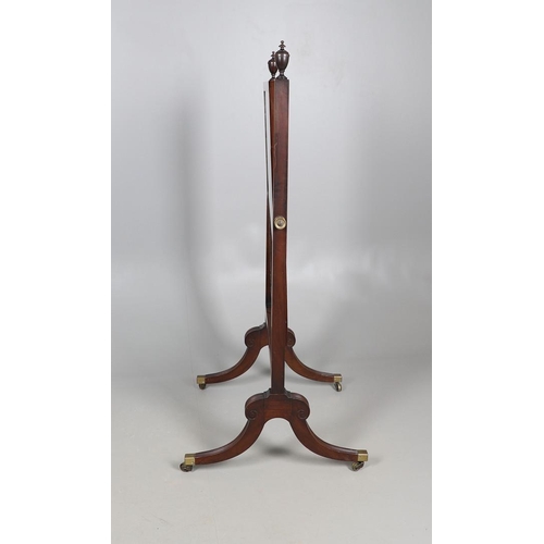 476 - A REGENCY MAHOGANY CHEVAL DRESSING MIRROR. the shorter than average frame with urn finials, on reede... 