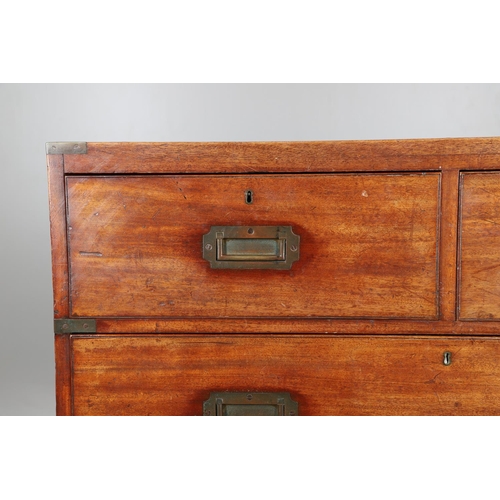 480 - AN EARLY 19TH CENTURY BRASS BOUND TEAK CAMPAIGN CHEST. the twin section comprising of two short over... 