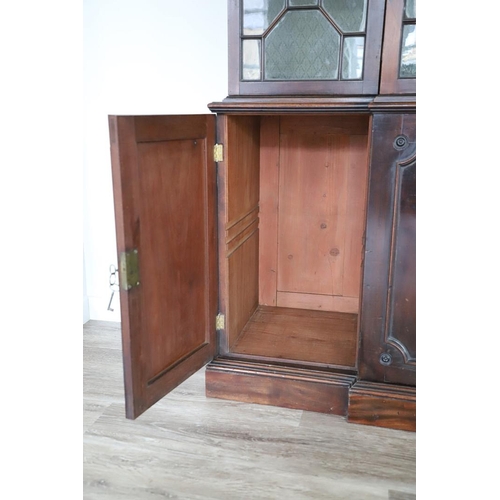 481 - A GEORGE III MAHOGANY LIBRARY BREAKFRONT BOOKCASE, CIRCA 1780. with Chippendale style fret cut scrol... 