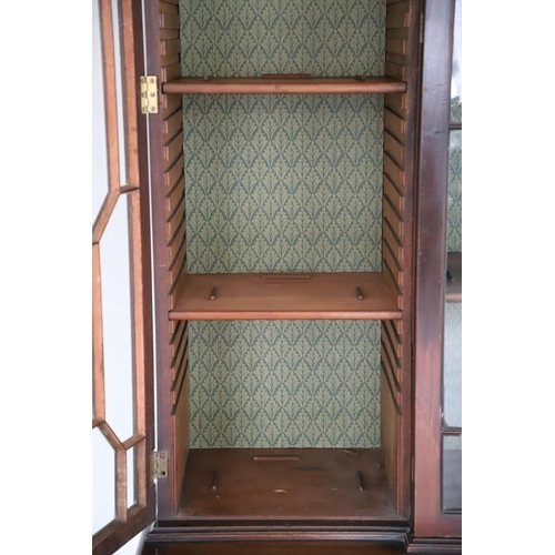 481 - A GEORGE III MAHOGANY LIBRARY BREAKFRONT BOOKCASE, CIRCA 1780. with Chippendale style fret cut scrol... 