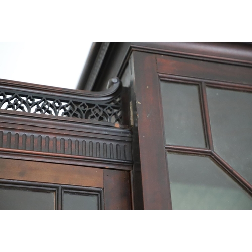 481 - A GEORGE III MAHOGANY LIBRARY BREAKFRONT BOOKCASE, CIRCA 1780. with Chippendale style fret cut scrol... 