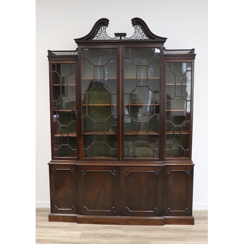 481 - A GEORGE III MAHOGANY LIBRARY BREAKFRONT BOOKCASE, CIRCA 1780. with Chippendale style fret cut scrol... 