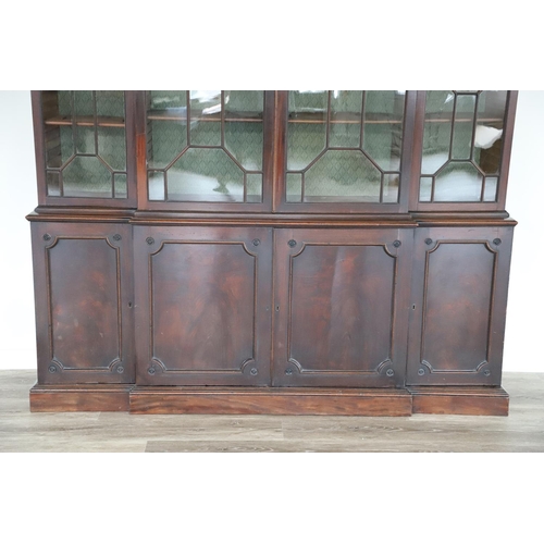 481 - A GEORGE III MAHOGANY LIBRARY BREAKFRONT BOOKCASE, CIRCA 1780. with Chippendale style fret cut scrol... 