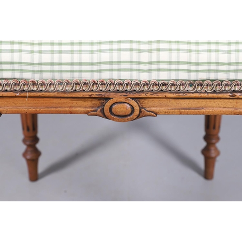 484 - A LATE 19TH CENTURY BEECH STOOL. the square top upholstered with green and cream check fabric upon t... 