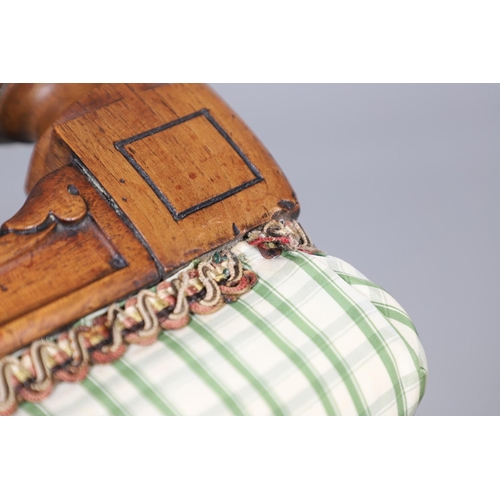 484 - A LATE 19TH CENTURY BEECH STOOL. the square top upholstered with green and cream check fabric upon t... 