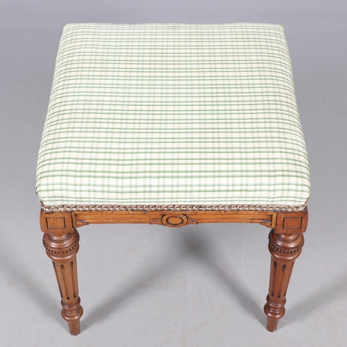 484 - A LATE 19TH CENTURY BEECH STOOL. the square top upholstered with green and cream check fabric upon t... 