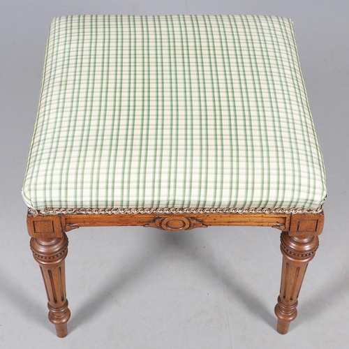 484 - A LATE 19TH CENTURY BEECH STOOL. the square top upholstered with green and cream check fabric upon t... 