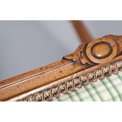 484 - A LATE 19TH CENTURY BEECH STOOL. the square top upholstered with green and cream check fabric upon t... 