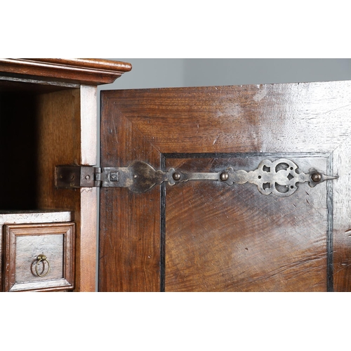 486 - AN 18TH CENTURY NORTHERN EUROPEAN OLIVEWOOD CABINET ON LATER STAND. surmounted by a drawer pediment ... 