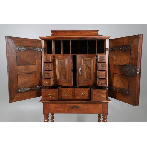 486 - AN 18TH CENTURY NORTHERN EUROPEAN OLIVEWOOD CABINET ON LATER STAND. surmounted by a drawer pediment ... 