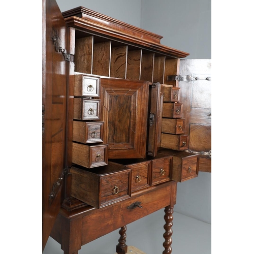 486 - AN 18TH CENTURY NORTHERN EUROPEAN OLIVEWOOD CABINET ON LATER STAND. surmounted by a drawer pediment ... 