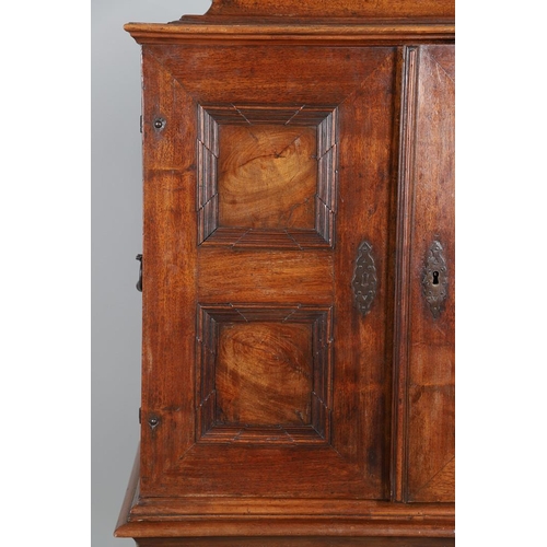 486 - AN 18TH CENTURY NORTHERN EUROPEAN OLIVEWOOD CABINET ON LATER STAND. surmounted by a drawer pediment ... 