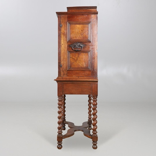 486 - AN 18TH CENTURY NORTHERN EUROPEAN OLIVEWOOD CABINET ON LATER STAND. surmounted by a drawer pediment ... 