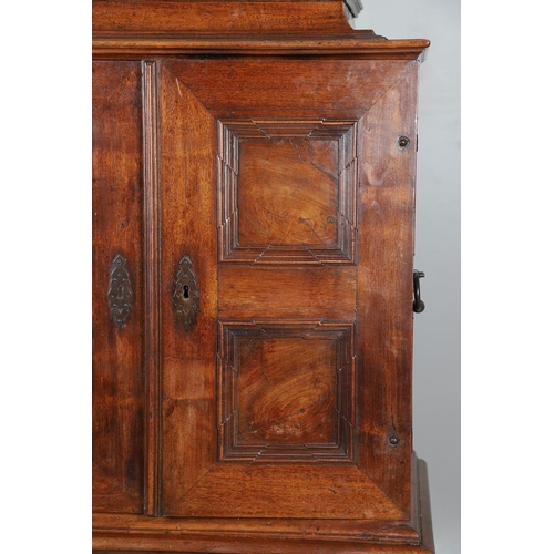 486 - AN 18TH CENTURY NORTHERN EUROPEAN OLIVEWOOD CABINET ON LATER STAND. surmounted by a drawer pediment ... 