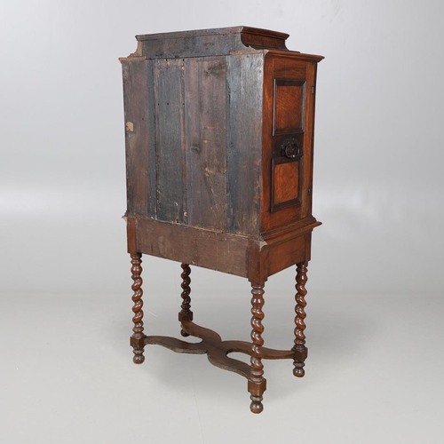 486 - AN 18TH CENTURY NORTHERN EUROPEAN OLIVEWOOD CABINET ON LATER STAND. surmounted by a drawer pediment ... 