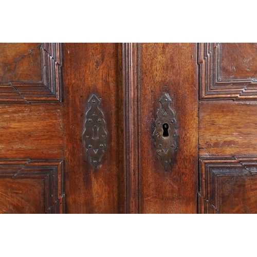 486 - AN 18TH CENTURY NORTHERN EUROPEAN OLIVEWOOD CABINET ON LATER STAND. surmounted by a drawer pediment ... 