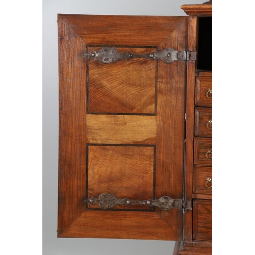 486 - AN 18TH CENTURY NORTHERN EUROPEAN OLIVEWOOD CABINET ON LATER STAND. surmounted by a drawer pediment ... 