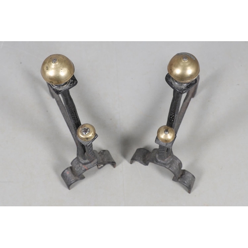 488 - A PAIR OF 18TH CENTURY STYLE WROUGHT IRON FIRE DOGS. with double brass ball finials and hammered geo... 