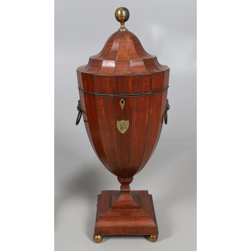 490 - A PAIR OF EARLY GEORGIAN MAHOGANY CUTLERY URNS AND COVERS. with rise and fall lids to interior fitte... 