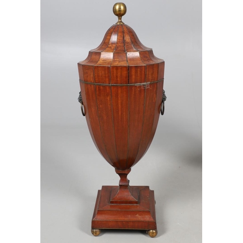 490 - A PAIR OF EARLY GEORGIAN MAHOGANY CUTLERY URNS AND COVERS. with rise and fall lids to interior fitte... 