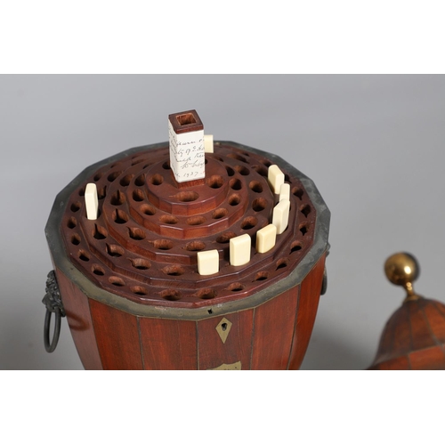 490 - A PAIR OF EARLY GEORGIAN MAHOGANY CUTLERY URNS AND COVERS. with rise and fall lids to interior fitte... 