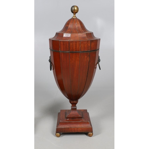 490 - A PAIR OF EARLY GEORGIAN MAHOGANY CUTLERY URNS AND COVERS. with rise and fall lids to interior fitte... 