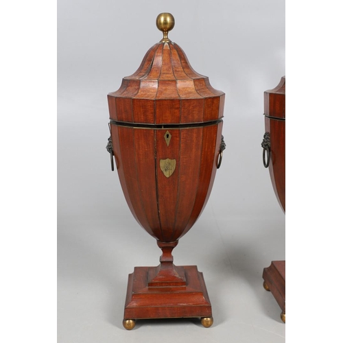 490 - A PAIR OF EARLY GEORGIAN MAHOGANY CUTLERY URNS AND COVERS. with rise and fall lids to interior fitte... 